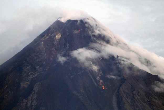 Mayon Volcano is seen emitting smoke in Albay province, Bicol region, south of Manila