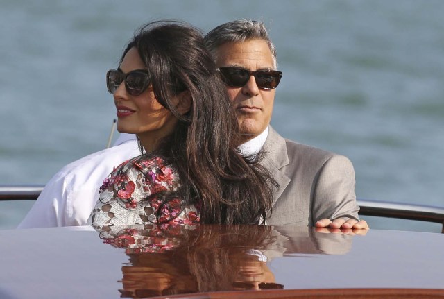 U.S. actor Clooney and his wife Alamuddin travel on a water taxi in the Grand Canal in Venice