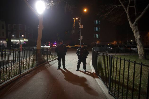 Police standby at the location where two NYPD officers were shot dead in Brooklyn, New York