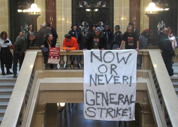 Protesters demonstrate outside of the Wisconsin Assembly, where lawmakers are debating a right-to-work bill, in Madison, Wisconsin