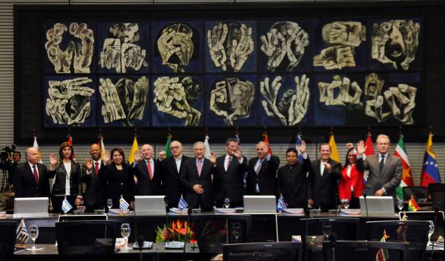 Foreign ministers of the South American bloc UNASUR pose during a photo op at the UNASUR headquarters in Quito