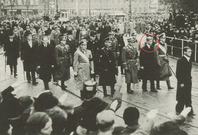Prince Philip pictured (2nd right in the first full row), in a funeral procession in 1937. On the right, in the uniform of the SA (Hitler' militia that was known as the 'storm division' or 'Brownshirts'), walks Prince Philipp von Hessen, brother of Philip's brother-in-law, Prince Christoph, who is next in line in full SS regalia. Philip's two surviving German brothers-in-law complete the row: Prince Gottfried of Hohenlohe-Langenburg and Prince Berthold of Baden. In the row behind, wearing a deistinctive Royal Navy bicorn hat, is Lord Louis Mountbatten, Philip's uncle. Through the damp streets of Darmstadt, western Germany, a funeral procession trudges its way slowly past the thousands of mourners who have come to pay their respects to the seven members of the aristocratic Hesse-Darmstadt family killed in a plane crash. As the cortege sweeps past, many give the Heil Hitler salute to the uniformed Nazis, including an SS officer, in the parade. Also in the procession that day in November 1937 is a handsom young man, just 16, in a long, dark overcoat. Flanked by German relatives in SS and Brownshirt uniforms, he has come to mourn the death of his elder sister. Who would have thought that just a decade later, this sombre young prince would become consort of the future Queen of England.  This picture was taken from the book: Royals And The Reich, by Jonathan Petropoulos, that will be published in May 2006 by Oxford University Press. Prince Philip.jpgPictures taken from the book "Royal and the Reich"