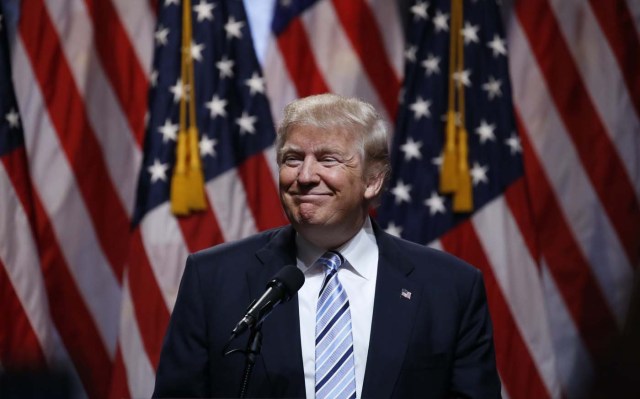 Republican U.S. presidential candidate Donald Trump pauses as he speaks before introducing Indiana Governor Mike Pence as his vice presidential running mate in New York City, U.S., July 16, 2016.  REUTERS/Carlo Allegri  TPX IMAGES OF THE DAY