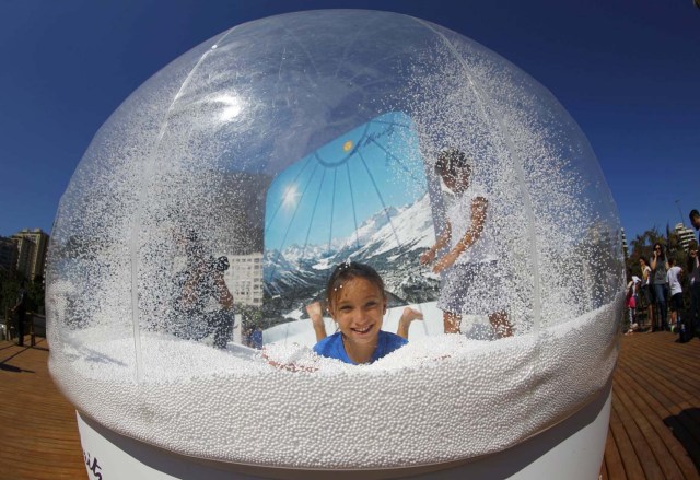 Rio Olympics - Lagoa - Rio de Janeiro, Brazil - 01/08/2016. A girl plays in a display at the Switzerland house. REUTERS/Ivan Alvarado FOR EDITORIAL USE ONLY. NOT FOR SALE FOR MARKETING OR ADVERTISING CAMPAIGNS.