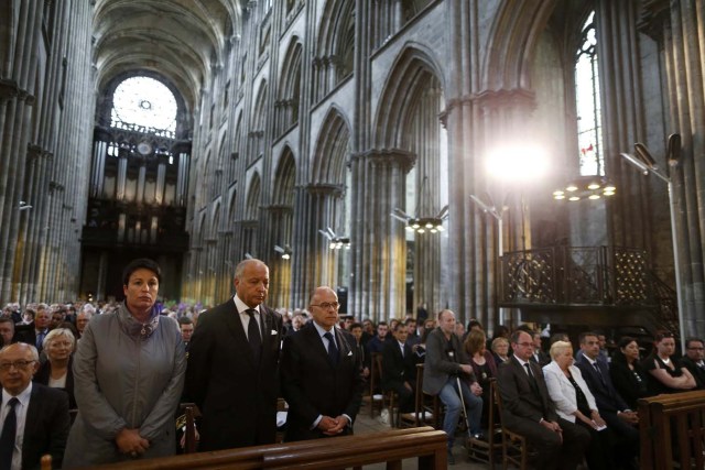 (From 2ndL) French Junior minister for Local Authorities Estelle Grelier, French President of the Constitutional Council Laurent Fabius and French Interior Minister Bernard Cazeneuve attend a funeral service to slain French parish priest Father Jacques Hamel at the Cathedral in Rouen, France, August 2, 2016. Father Jacques Hamel was killed last week in an attack on a church at Saint-Etienne-du-Rouvray near Rouen that was carried out by assailants linked to Islamic State.   REUTERS/Charly Triballeau/Pool