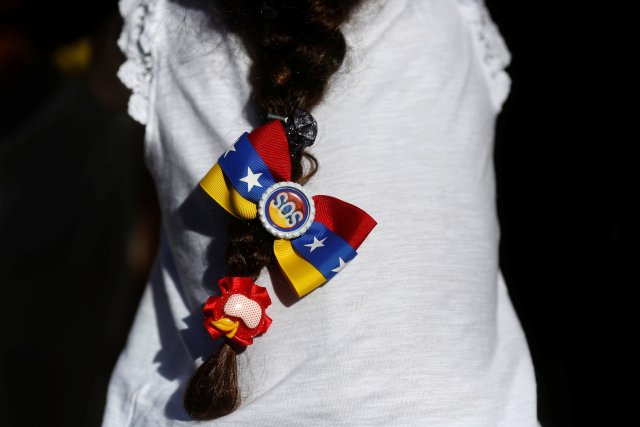 A girl takes part in a demonstration to demand a referendum to remove Venezuela's President Nicolas Maduro, in Madrid, Spain, September 4, 2016. REUTERS/Susana Vera