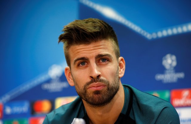 Barcelona's Gerard Pique attends a news conference. REUTERS/Albert Gea