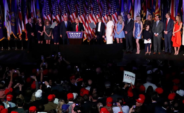 U.S. President-elect Donald Trump is flanked by members of his family as well as relatives of Vice President-elect Mike Pence while speaking at his election night rally in Manhattan, New York, U.S., November 9, 2016. REUTERS/Andrew Kelly