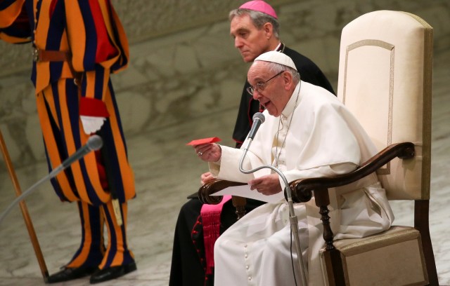 Pope Francis shows a free ticket during his Wednesday general audience in Paul VI hall at the Vatican January 11, 2017. REUTERS/Alessandro Bianchi