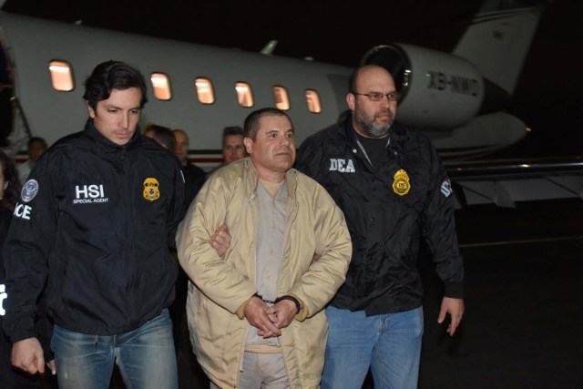 Mexico's top drug lord Joaquin "El Chapo" Guzman is escorted as he arrives at Long Island MacArthur airport in New York, U.S., January 19, 2017, after his extradition from Mexico. U.S. officials/Handout via REUTERS      ATTENTION EDITORS - THIS IMAGE WAS PROVIDED BY A THIRD PARTY. EDITORIAL USE ONLY.     TPX IMAGES OF THE DAY