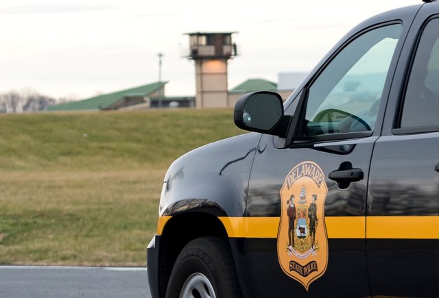 REFILE - CORRECTING DATE A Delaware State Police vehicle overlooks the James T. Vaughn Corrections Center during a lockdown where hostages were taken in an incident at the men's prison in Smyrna, Delaware, U.S., February 1, 2017.   REUTERS/Doug Curran