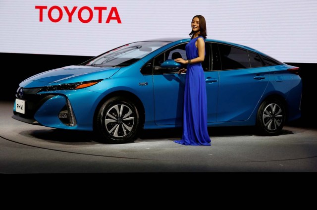 Japanese actress Satomi Ishihara poses next to Toyota Motor Corp.' Prius PHV Plug-in-Hybrid vehicle, also known as Prius Prime in the U.S., during an event to mark the launch of the car in Japan, in Tokyo, Japan February 15, 2017. REUTERS/Issei Kato