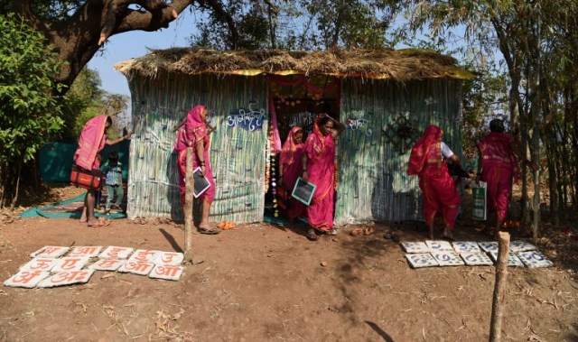 This photo taken on March 1, 2017 shows women leaving a class at Aajibaichi Shala, or "school for grannies" in the local Marathi language, in Phangane village in Maharashtra state's Thane district, some 125km northeast of Mumbai. They wear uniforms, carry satchels, and eagerly recite the alphabet in class, but the students here are different -- this is a "school for grannies". Deprived of an education as children, the women -- most of whom are widows and aged between 60 and 90 -- are finally fulfilling a life-long dream to become literate through this unique initiative near Mumbai. / AFP PHOTO / Indranil MUKHERJEE / TO GO WITH "India-education-women-school,FEATURE" by Peter HUTCHISON