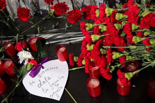 A heart-shaped message, that reads in Spanish " We love you Lola, your family misses you", is placed next to flowers outside Atocha station on the 13th anniversary of the attacks in Madrid, Spain, March 11, 2017. REUTERS/Sergio Perez