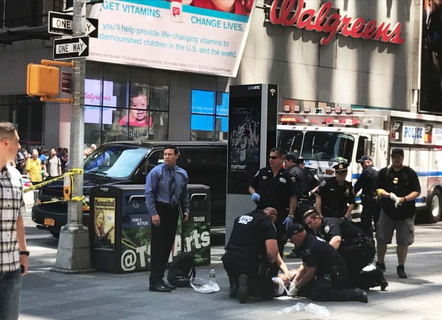 First responders are assisting injured pedestrians after a vehicle struck pedestrians on a sidewalk in Times Square in New York, U.S., May 18, 2017. REUTERS/Jeremy Schultz
