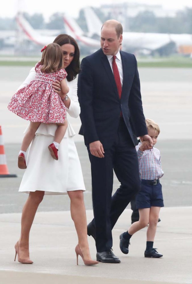 Prince William, the Duke of Cambridge, his wife Catherine, The Duchess of Cambridge, Prince George and Princess Charlotte arrive at a military airport in Warsaw, Poland July 17, 2017. REUTERS/Kacper Pempel