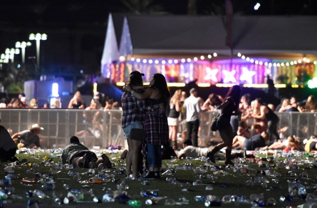 LAS VEGAS, NV - OCTOBER 01: People run from the Route 91 Harvest country music festival after apparent gun fire was heard on October 1, 2017 in Las Vegas, Nevada. There are reports of an active shooter around the Mandalay Bay Resort and Casino.   David Becker/Getty Images/AFP