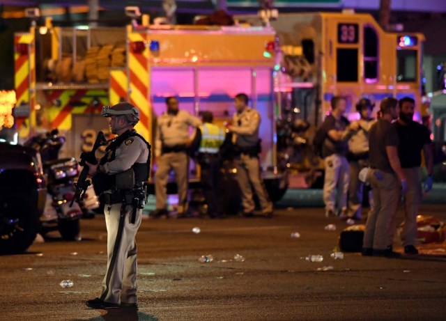 LAS VEGAS, NV - OCTOBER 02: A Las Vegas Metropolitan Police Department officer stands in the intersection of Las Vegas Boulevard and Tropicana Ave. after a mass shooting at a country music festival nearby on October 2, 2017 in Las Vegas, Nevada. A gunman has opened fire on a music festival in Las Vegas, leaving at least 20 people dead and more than 100 injured. Police have confirmed that one suspect has been shot. The investigation is ongoing. Ethan Miller/Getty Images/AFP