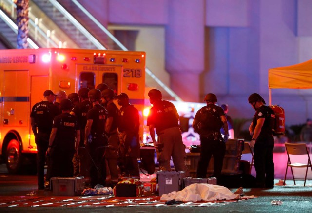 ATTENTION EDITORS - VISUAL COVERAGE OF SCENES OF INJURY OR DEATH A body is covered with a sheet in the intersection of Tropicana Avenue and Las Vegas Boulevard South after a mass shooting at a music festival on the Las Vegas Strip in Las Vegas, Nevada, U.S. October 1, 2017. REUTERS/Las Vegas Sun/Steve Marcus TPX IMAGES OF THE DAY