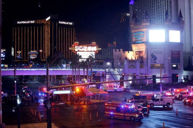 Las Vegas Metro Police and medical workers stage in the intersection of Tropicana Avenue and Las Vegas Boulevard South after a mass shooting at a music festival on the Las Vegas Strip in Las Vegas, Nevada, U.S. October 1, 2017. REUTERS/Las Vegas Sun/Steve Marcus TPX IMAGES OF THE DAY