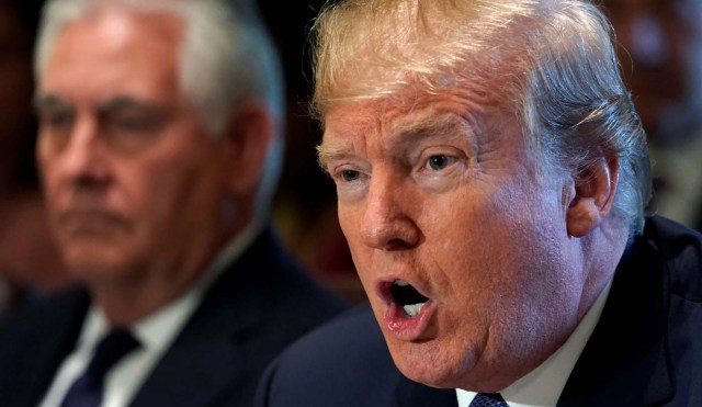 Secretary of State Rex Tillerson (L) sits beside U.S. President Donald Trump during a cabinet meeting at the White House in Washington, U.S., November 1, 2017.  REUTERS/Kevin Lamarque