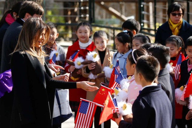 U.S. first lady Melania Trump talks to children during her visit to Beijing Zoo in Beijing, China, November 10, 2017. REUTERS/Thomas Peter