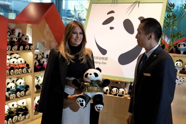 U.S. first lady Melania Trump poses with a panda plushie after visiting the panda enclosure at the zoo in Beijing, China, November 10, 2017. REUTERS/Ng Han Guan/Pool