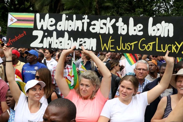 Protesters calling for Zimbabwean President Robert Mugabe to step down take to the streets in Harare, Zimbabwe, November 18, 2017. REUTERS/Philimon Bulawayo