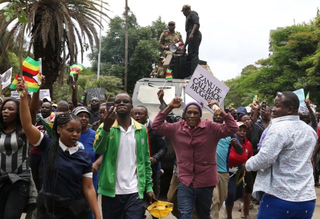 Protesters calling for Zimbabwean President Robert Mugabe to step down take to the streets in Harare, Zimbabwe, November 18, 2017. REUTERS/Philimon Bulawayo