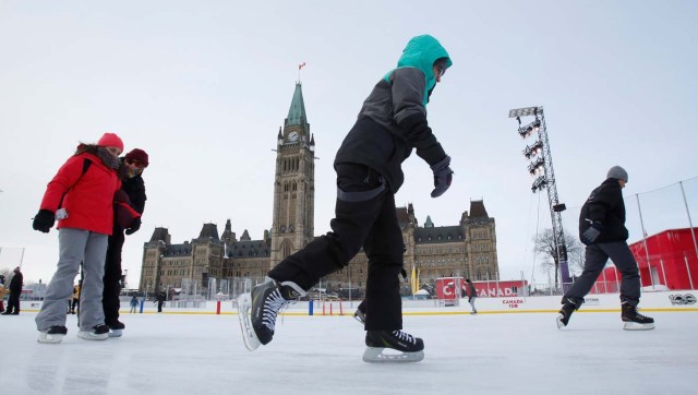 People brave the frigid weather to skate on an outdoor rink on Parliament Hill in Ottawa, Ontario, Canada, December 29, 2017. REUTERS/Patrick Doyle