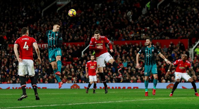 Soccer Football - Premier League - Manchester United vs Southampton - Old Trafford, Manchester, Britain - December 30, 2017   Southampton's Dusan Tadic heads at goal                    Action Images via Reuters/Jason Cairnduff    EDITORIAL USE ONLY. No use with unauthorized audio, video, data, fixture lists, club/league logos or "live" services. Online in-match use limited to 75 images, no video emulation. No use in betting, games or single club/league/player publications.  Please contact your account representative for further details.