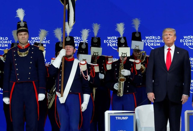 U.S. President Donald Trump listens to concert and marching band Landwehr de Fribourg, during the World Economic Forum (WEF) annual meeting in Davos, Switzerland January 26, 2018. REUTERS/Denis Balibouse