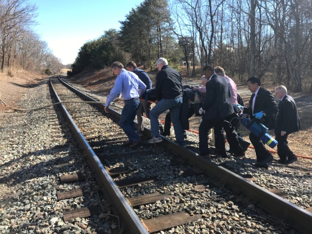 Emergency first responders and passengers from an Amtrak passenger train carrying Republican members of the U.S. Congress from Washington to a retreat in West Virginia carry one of the injured across train tracks to an ambulance after the train collided with a garbage truck in Crozet, Virginia, U.S. January 31, 2018.   Justin Ide/Crozet Volunteer Fire Department/Handout via REUTERS  ATTENTION EDITORS - THIS IMAGE WAS PROVIDED BY A THIRD PARTY.