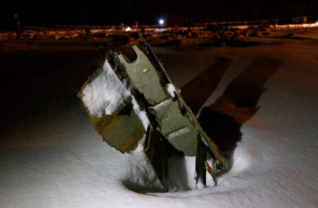 A part of a Saratov Airlines Antonov AN-148 plane that crashed after taking off from Moscow's Domodedovo airport, is seen at the scene of the incident outside Moscow, Russia February 11, 2018. REUTERS/Sergei Karpukhin