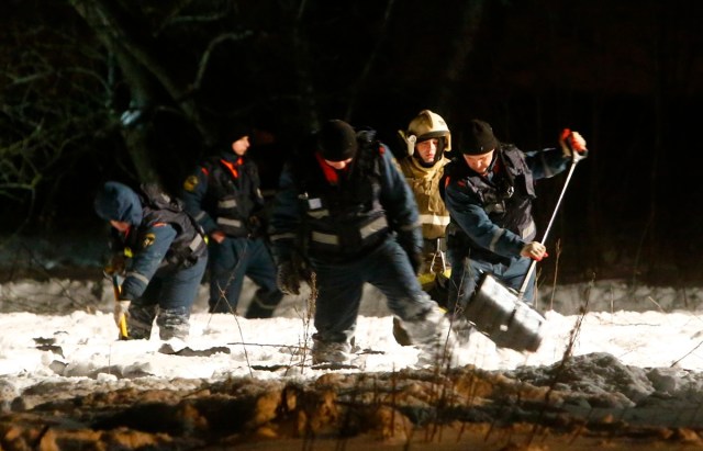 Emergency services work at the scene where a Saratov Airlines Antonov AN-148 plane crashed after taking off from Moscow's Domodedovo airport, outside Moscow, Russia February 11, 2018. REUTERS/Sergei Karpukhin