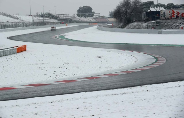 F1 Formula One - Formula One Test Session - Circuit de Barcelona-Catalunya, Montmelo, Spain - February 28, 2018 Race control check the track surrounded by snow before testing REUTERS/Albert Gea