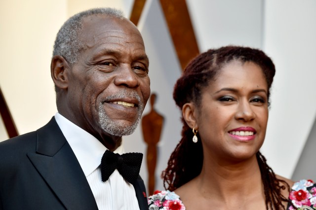 HOLLYWOOD, CA - MARCH 04: Danny Glover (L) and Eliane Cavalleiro attend the 90th Annual Academy Awards at Hollywood & Highland Center on March 4, 2018 in Hollywood, California. Frazer Harrison/Getty Images/AFP