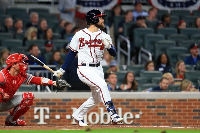 ATLANTA, GA - MARCH 30: Ender Inciarte #11 of the Atlanta Braves hits a sacrifice fly to drive in Ryan Flaherty #27 during the third inning against the Philadelphia Phillies at SunTrust Park on March 30, 2018 in Atlanta, Georgia.   Daniel Shirey/Getty Images/AFP