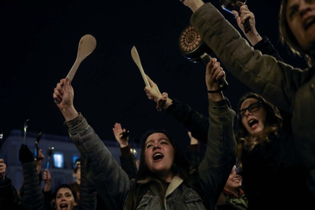 Women bang pots and pans during a protest at the start of a nationwide feminist strike on International Women's Day at Puerta del Sol Square in Madrid, Spain, March 8, 2018. REUTERS/Susana Vera