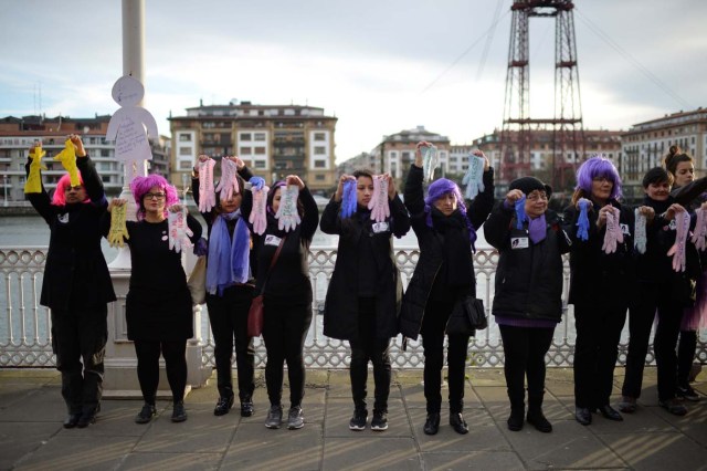 Protesters hold up gloves while taking part in a strike for women's rights in Portugalete, Spain, March 8, 2018, on International Women's Day. REUTERS/Vincent West