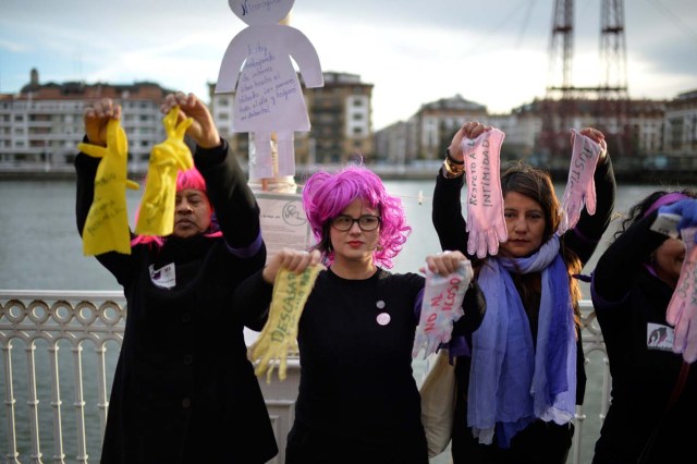 Protesters hold up gloves while taking part in a strike for women's rights in Portugalete, Spain, March 8, 2018, on International Women's Day. REUTERS/Vincent West