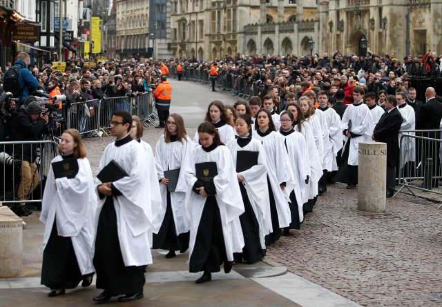 Members of the church choir arrive at Great St Marys Church, where the funeral of theoretical physicist Prof Stephen Hawking is being held, in Cambridge, Britain, March 31, 2018. REUTERS/Henry Nicholls