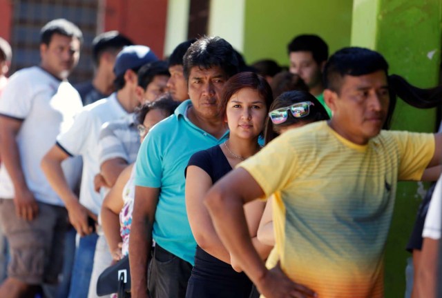 People line up to cast their vote during Paraguay's national elections, on the outskirts of Asuncion, Paraguay April 22, 2018. REUTERS/Andres Stapff
