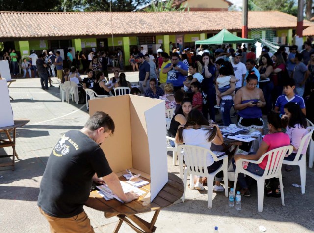 A man choses his vote during Paraguay's national elections in the outskirts of Asuncion, Paraguay April 22, 2018. REUTERS/Mario Valdez