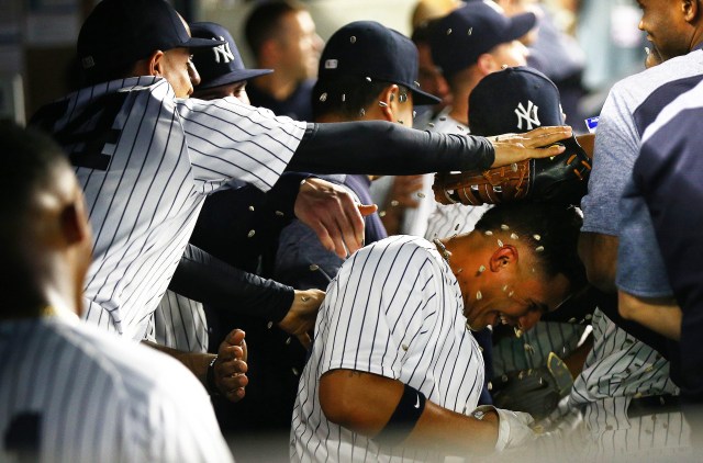 May 4, 2018; Bronx, NY, USA; New York Yankees second baseman Gleyber Torres (25) is showered with peanuts after hitting a three run home run against the Cleveland Indians during the fourth inning at Yankee Stadium. Mandatory Credit: Andy Marlin-USA TODAY Sports